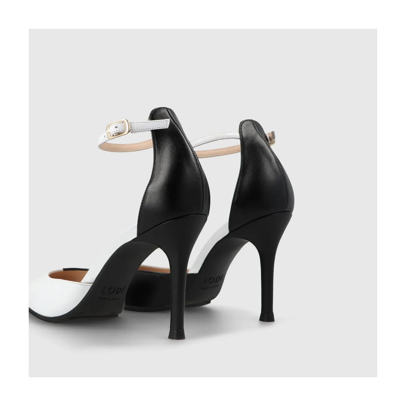 Escarpin pour femme en cuir combiné noir et blanc avec bride à la cheville. I LODI Chaussures pour femme online.