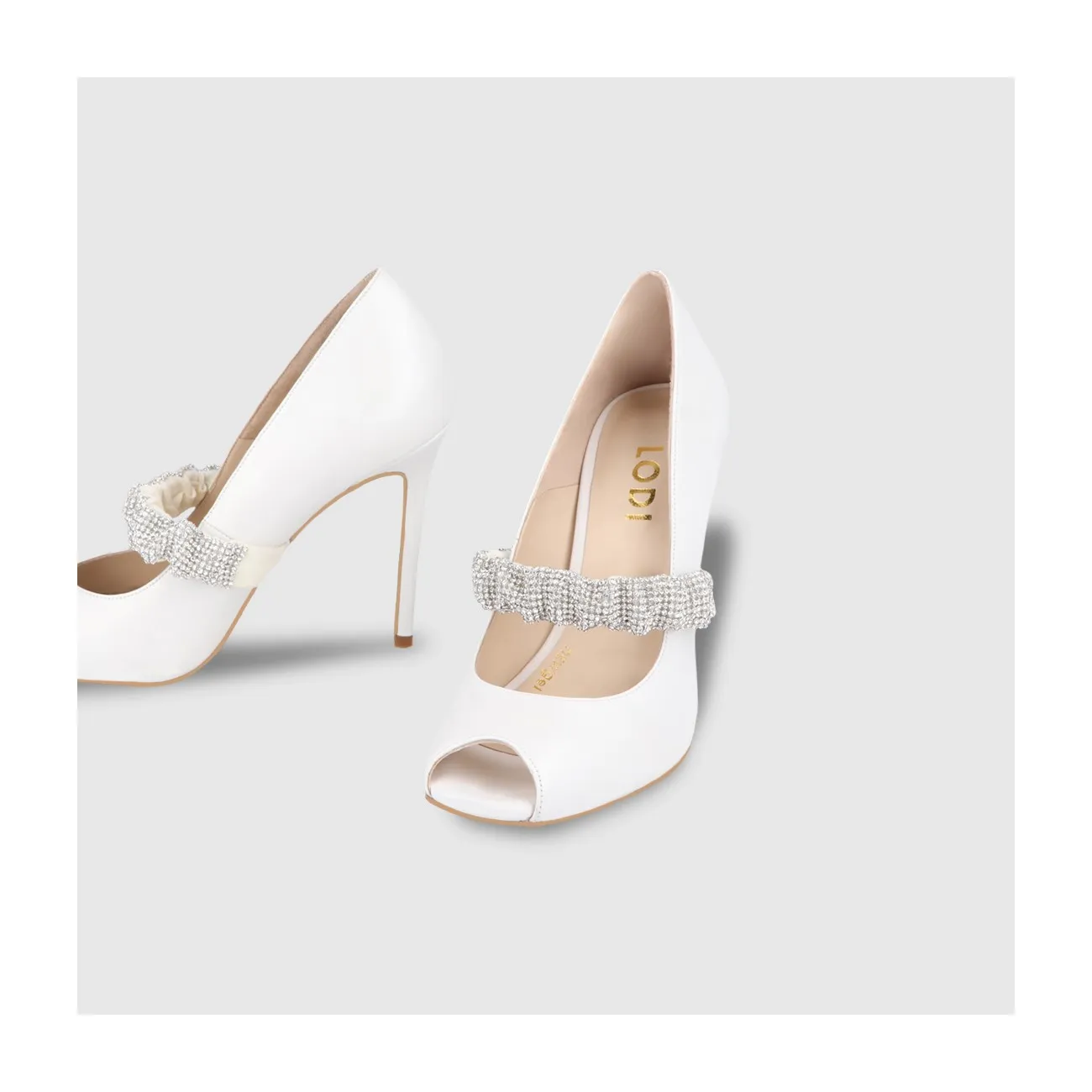 Escarpins de mariée en cuir blanc avec détail de sangle élastique en cristal | Chaussures femme LODI en ligne.